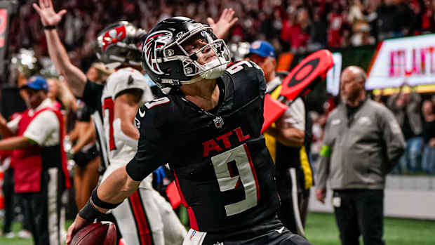 Atlanta Falcons quarterback Desmond Ridder (9) reacts after scoring a touchdown against the Tampa Bay Buccaneers during the second half at Mercedes-Benz Stadium.